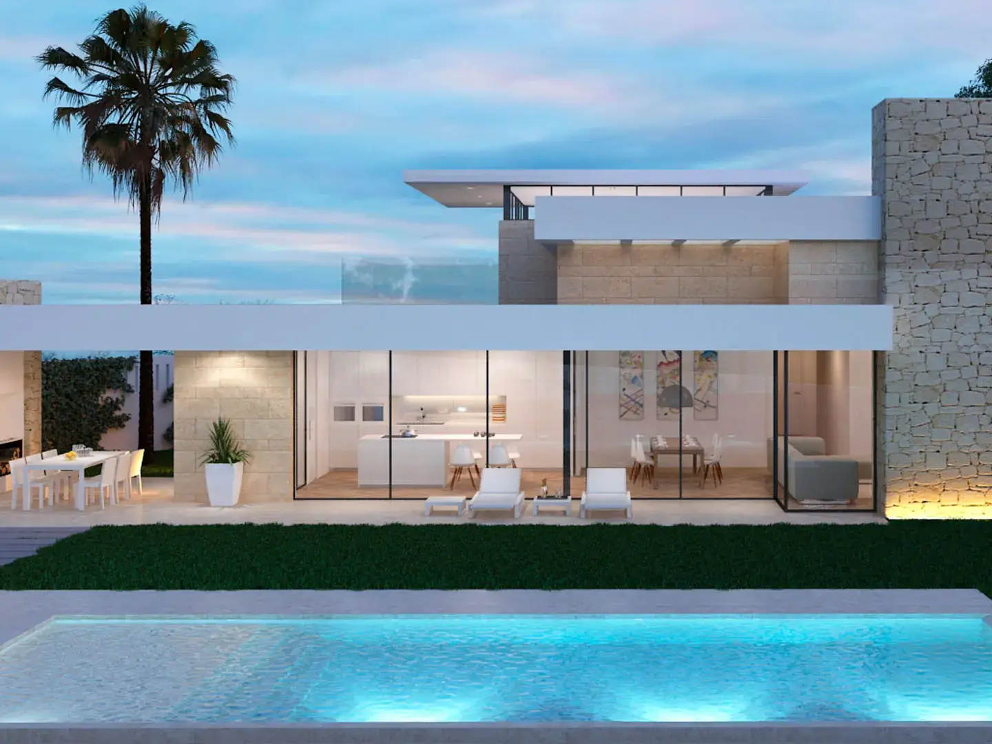 Una villa moderna de dos plantas con fachada blanca y detalles en piedra. La planta baja cuenta con grandes ventanales que ofrecen vistas al interior de la casa, incluyendo la cocina, el comedor y la sala de estar.